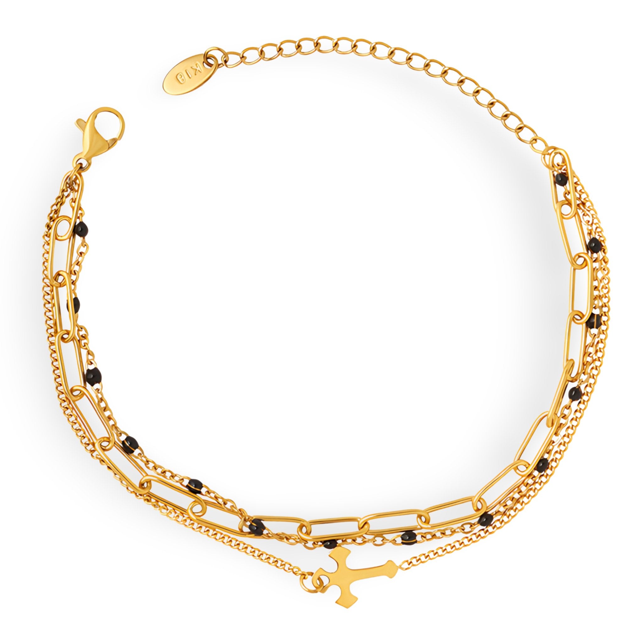Bracelet triple rang en titane plaqué or avec motif croix et petites perles noires.