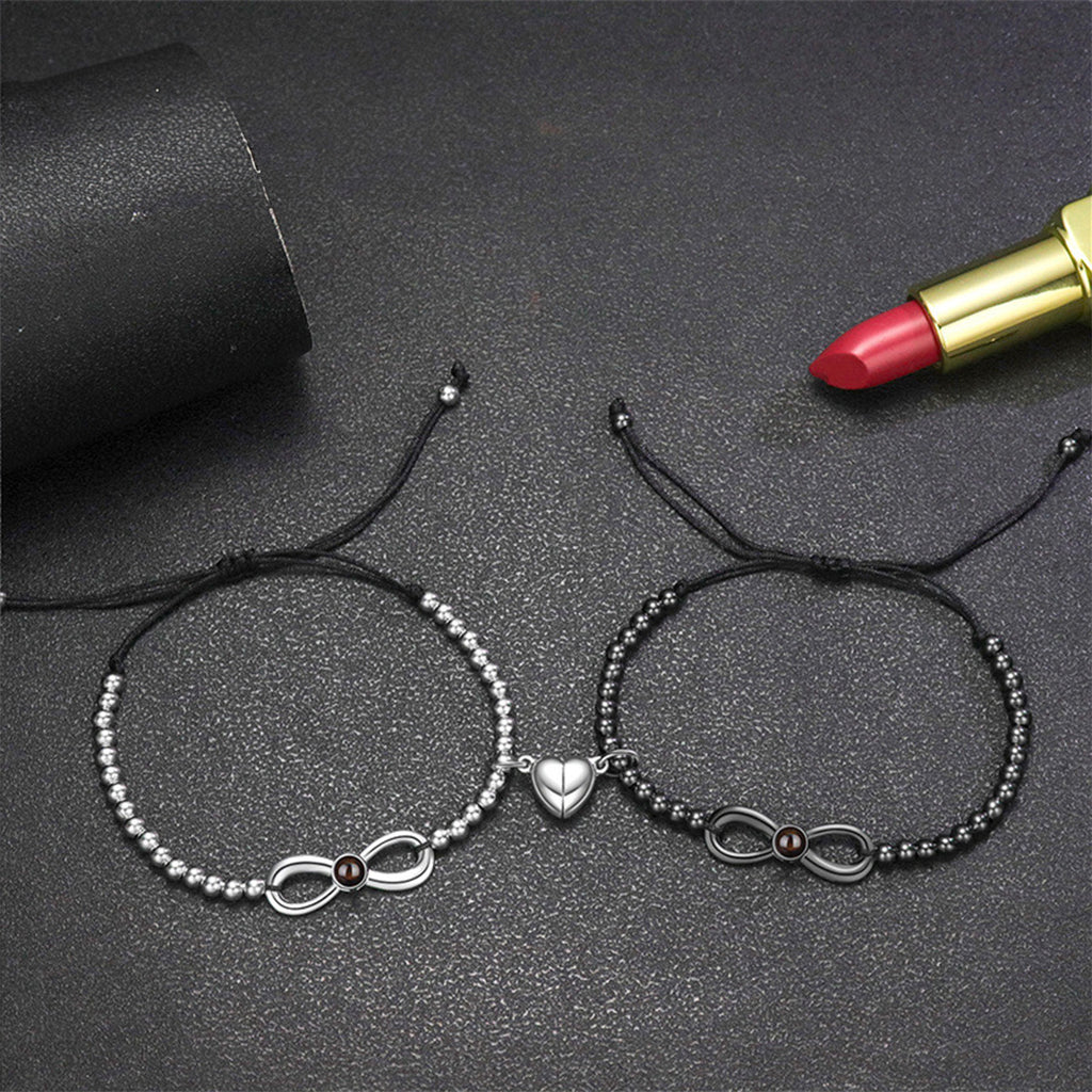 Bracelets noirs et argentés avec perles, symbole infini et cœur en métal, cordon ajustable.