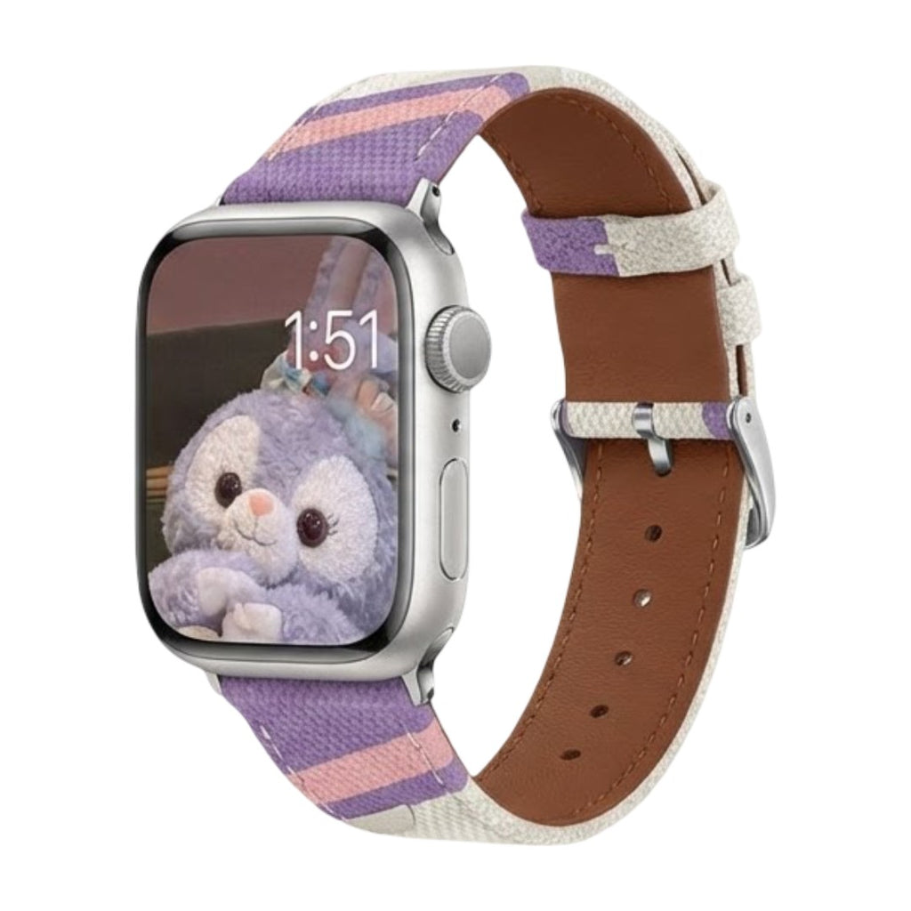 Bracelet pour Apple Watch en toile tissée violette et beige avec intérieur cuir marron et boucle argentée.