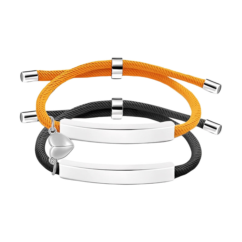 Bracelets couple en corde orange et noire, acier inoxydable avec plaques gravables et cœur aimanté argenté.
