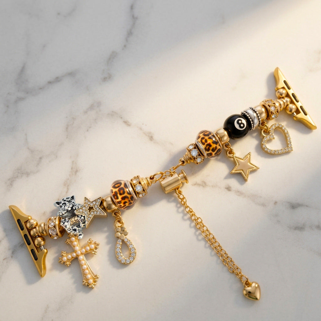 Bracelet Apple Watch à charms dorés, croix ornée de perles, étoiles scintillantes, billes léopard, boule de billard, fermoir coulissant réglable, modèle Junia