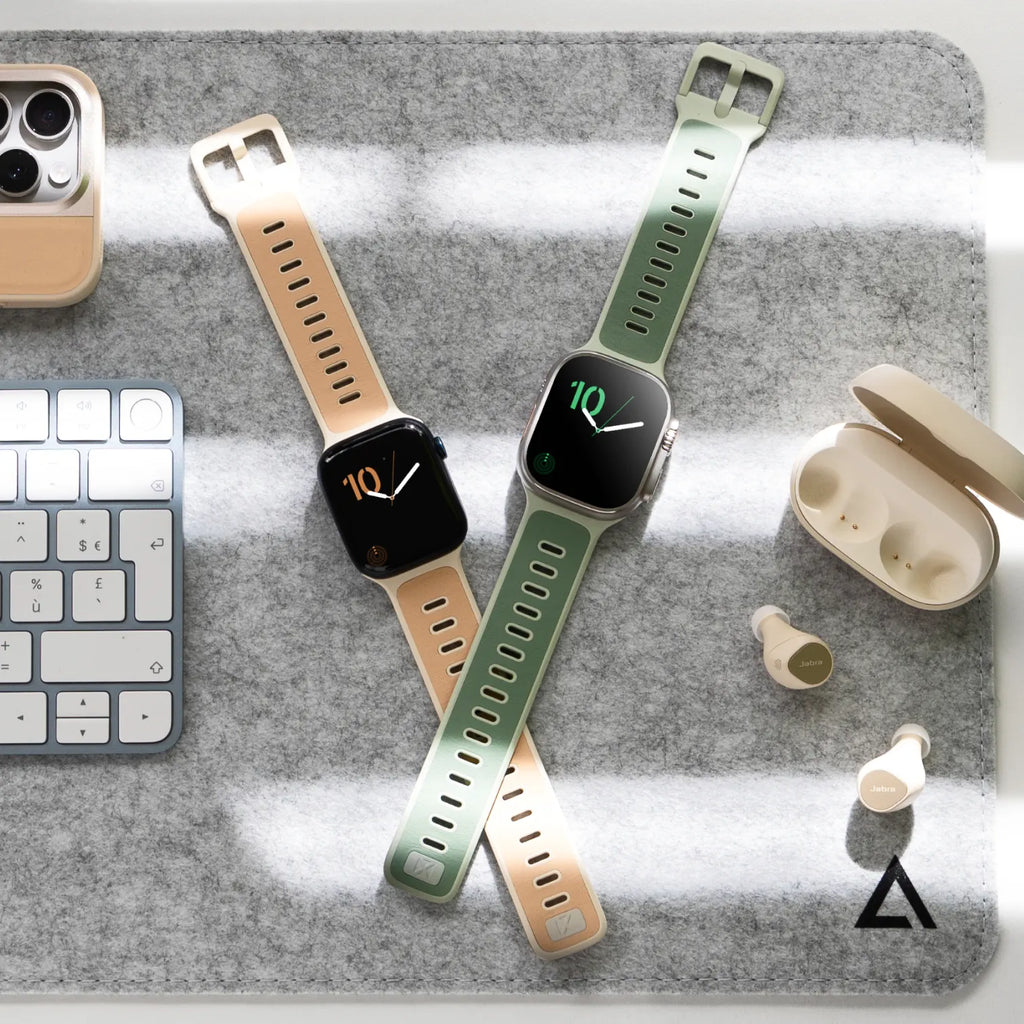 Bracelets Apple Watch hybrides en cuir beige et fluoroélastomère vert, boucles ajustables, design élégant et sportif.