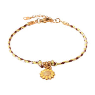 Bracelet en coton rose et gris avec fleur centrale en acier inoxydable doré.