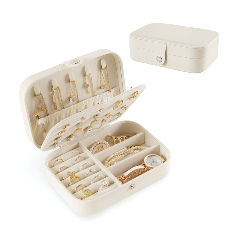 Boîte à bijoux nomade moyenne Martina en cuir blanc avec compartiments et crochets internes.