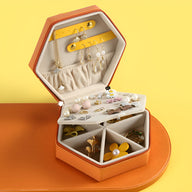 Boîte à bijoux hexagonale orange et jaune avec compartiments et rangement à bijoux multiples.