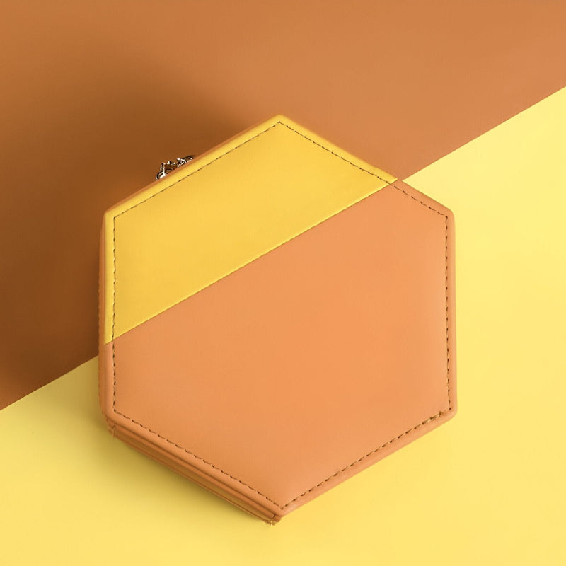 Boîte à bijoux hexagonale bi-colore orange et jaune en cuir élégant.