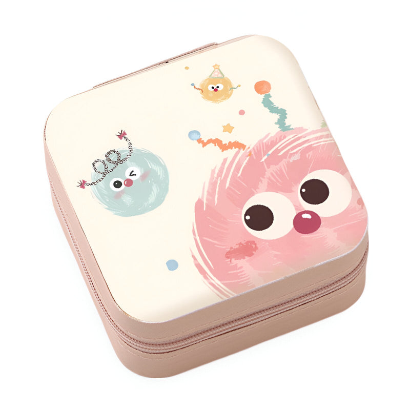 Boîte à bijoux carrée rose pâle avec motif monstres colorés et fermeture éclair.