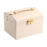 Boîte à bijoux nomade crème avec poignée et fermeture dorée, design compact et élégant.