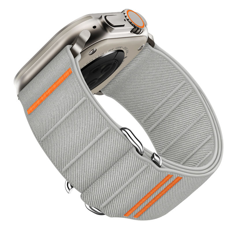 Bracelet à boucle en nylon gris clair avec détail orange pour Apple Watch, style tactique et ajustable.
