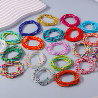Bracelets à enrouler en perles de résine élastique multicolores pour femme, différents tons vifs et pastel.