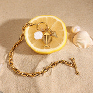Bracelet à maille, pendentif poisson et coquillage, doré, en acier inoxydable, pour femme, modèle Lunith - La Boutique du Bracelet