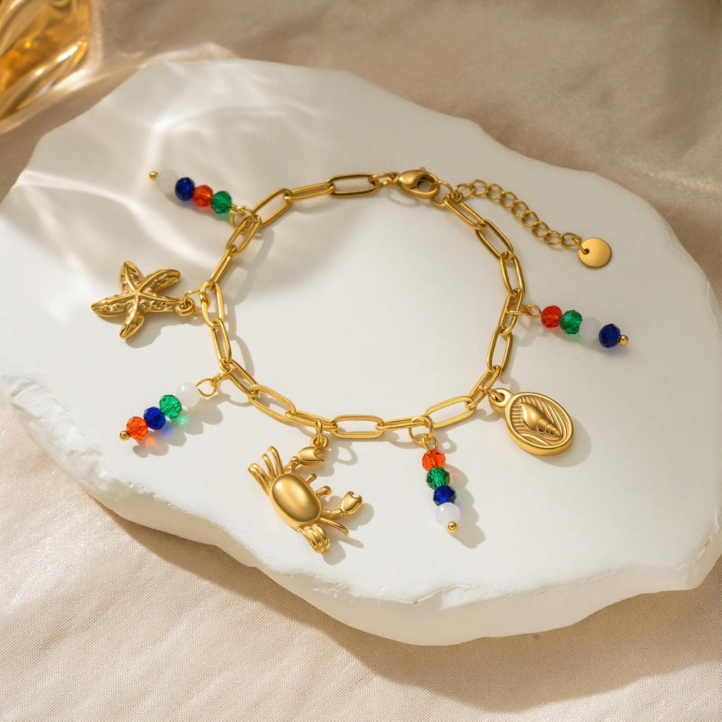 Bracelet à mailles dorées, charms marins et perles colorées, bijou d'été ajustable, modèle Toila