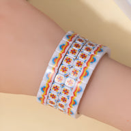 Bracelet en acrylique blanc avec motif floral orange et bleu, style Hyacinth, pour femme.