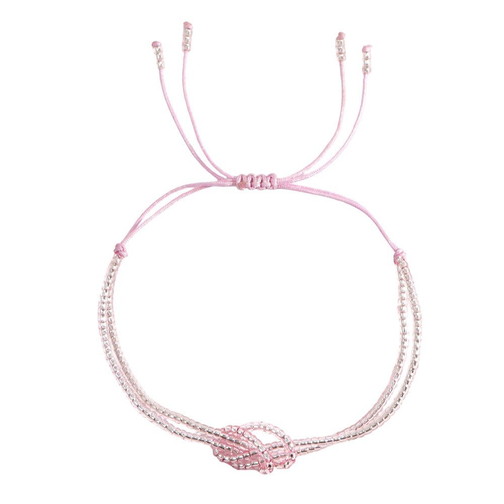 Bracelet rose clair à perles miyuki multicolores avec nœud central en perles, cordon coulissant ajustable.