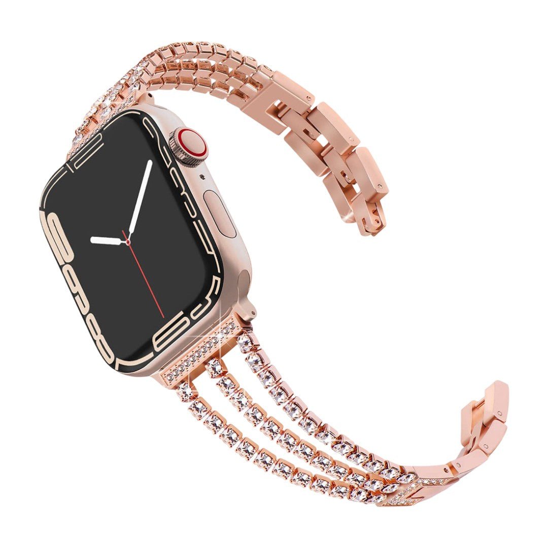 Bracelet pour Apple Watch en métal rose doré avec trois rangées de cristaux scintillants et fermoir élégant.