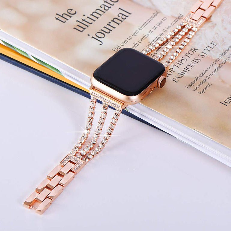 Bracelet pour Apple Watch en métal rose doré avec cristaux scintillants et fermoir raffiné double chaîne.