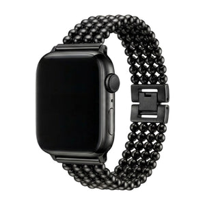 Bracelet pour Apple Watch en acier inoxydable noir avec perles métalliques et fermoir cliquet sécurisé.