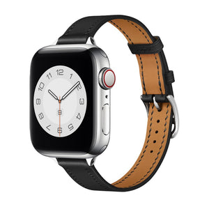 Bracelet Apple Watch en cuir noir avec couture contrastée beige et boucle métallique argentée.