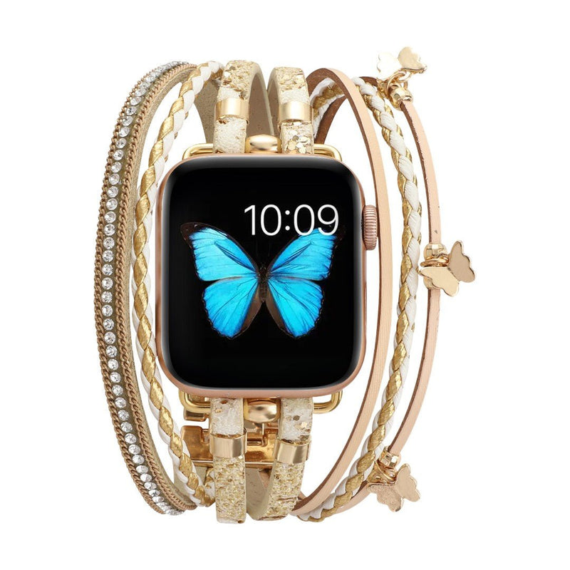 Bracelet Apple Watch en cuir or rose multi-rangs avec strass brillants et papillons métalliques, fermoir boucle refined.
