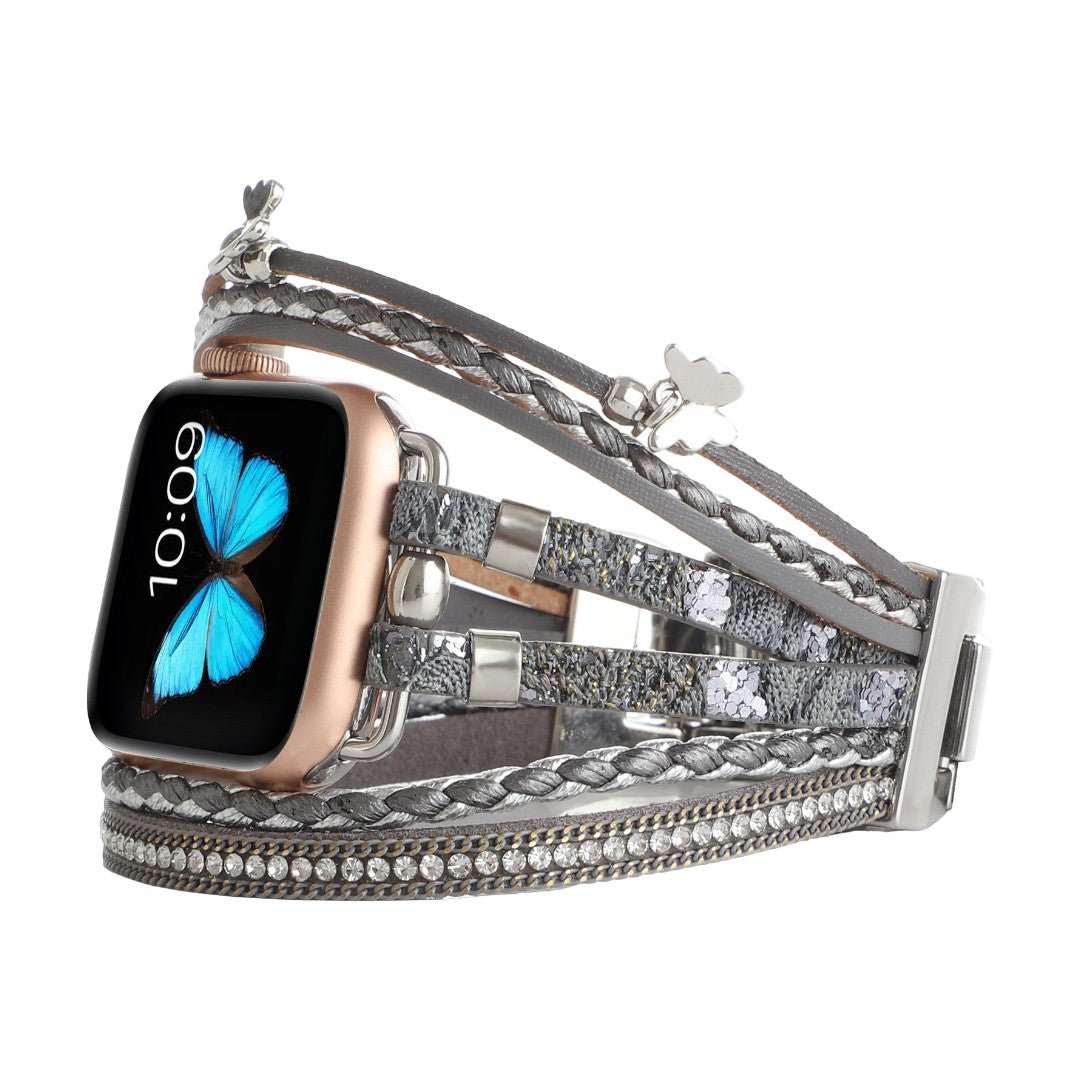 Bracelet Apple Watch multi-rangs en cuir gris avec strass brillants et papillon argenté, fermoir boucle.