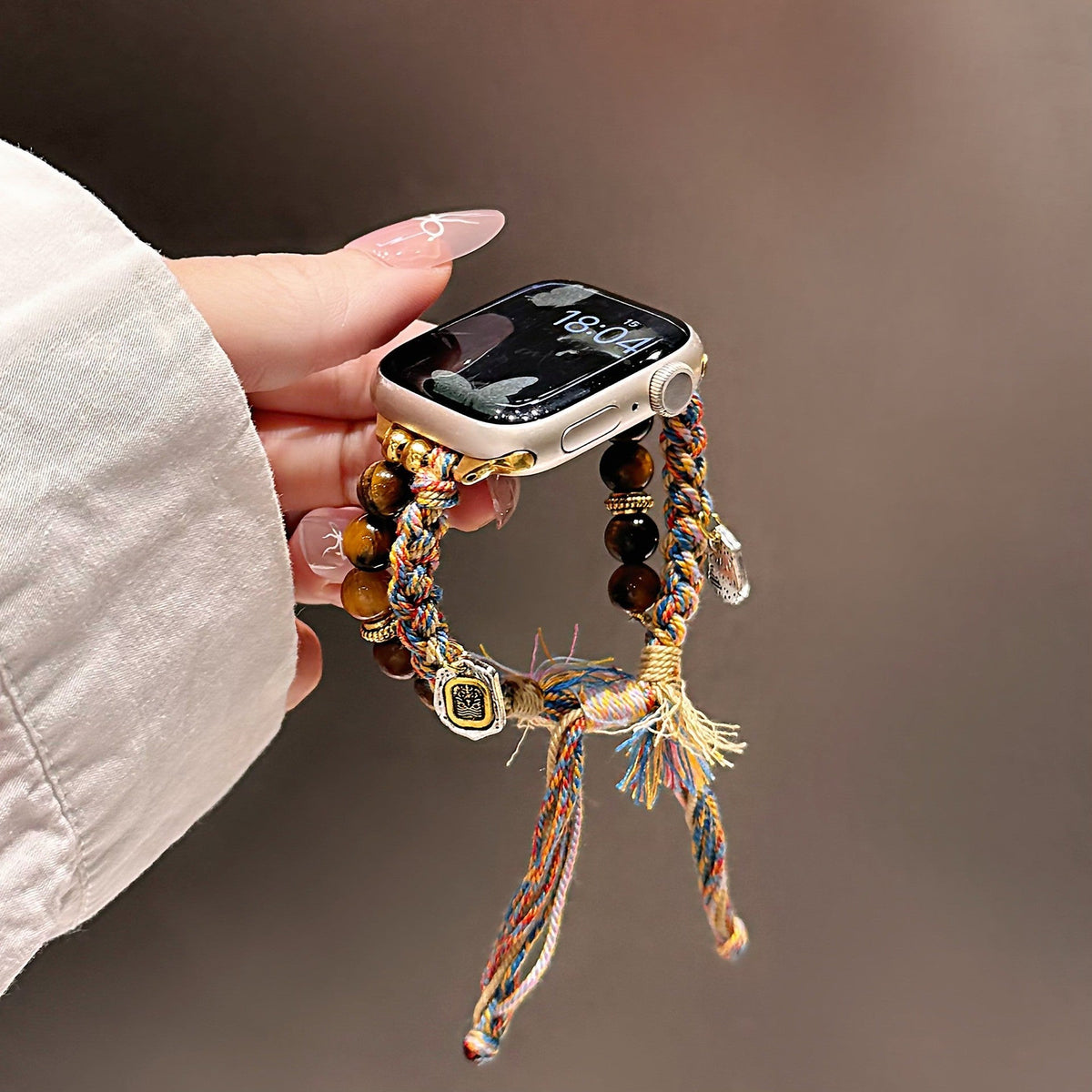 Natural Tiger’s Eye Apple Watch Bracelet, multicolored braided cord, gold charms, Tenzin model