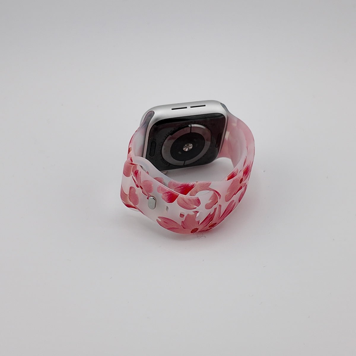 Bracelet Apple Watch femme en silicone blanc à motifs roses et rouges abstraits, modèle Saroa.
