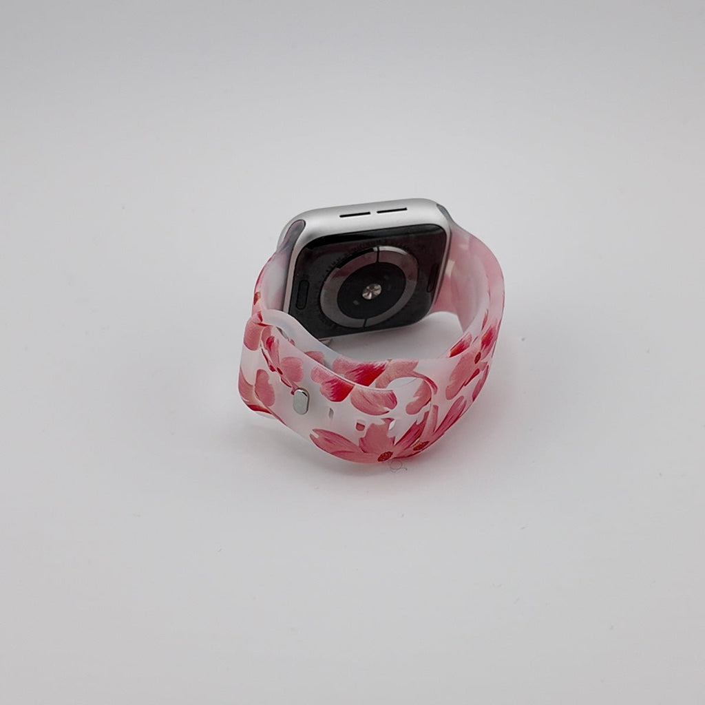 Bracelet Apple Watch femme en silicone blanc à motifs roses et rouges abstraits, modèle Saroa.