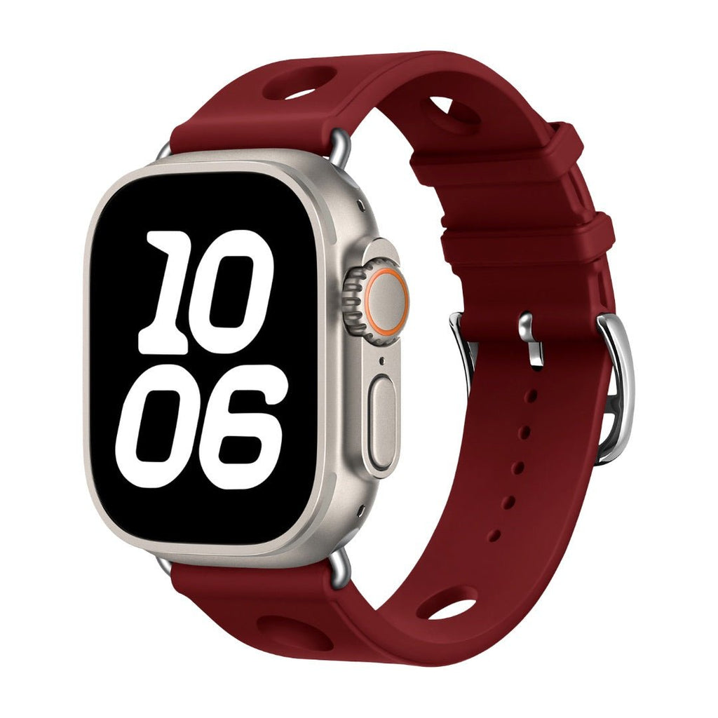 Bracelet en silicone rouge bordeaux perforé avec fermoir en acier inoxydable adapté pour Apple Watch style dynamique.