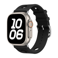 Bracelet Apple Watch noir en silicone perforé avec fermoir en acier inoxydable, style sportif et respirant.