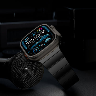 Bracelet Apple Watch en titane gris anthracite avec maillons larges, fermeture magnétique sécurisée, design moderne et épuré.