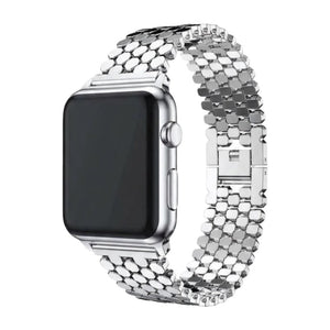 Bracelet Apple Watch doré en métal avec mailles alvéolées ruche, fermoir invisible, design luxueux et ajustable.