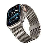 Bracelet maille milanaise en acier inoxydable gris argenté avec fermoir sécurité parachute, compatible Apple Watch.