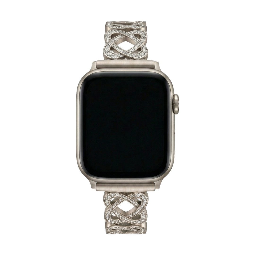 Pulseira para Apple Watch em metal prateado com malhas entrelaçadas, motivo de nó infinito cravejado de zircónias, fecho de encaixe ajustável, modelo Zergone