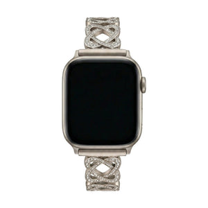 Pulseira para Apple Watch em metal prateado com malhas entrelaçadas, motivo de nó infinito cravejado de zircónias, fecho de encaixe ajustável, modelo Zergone