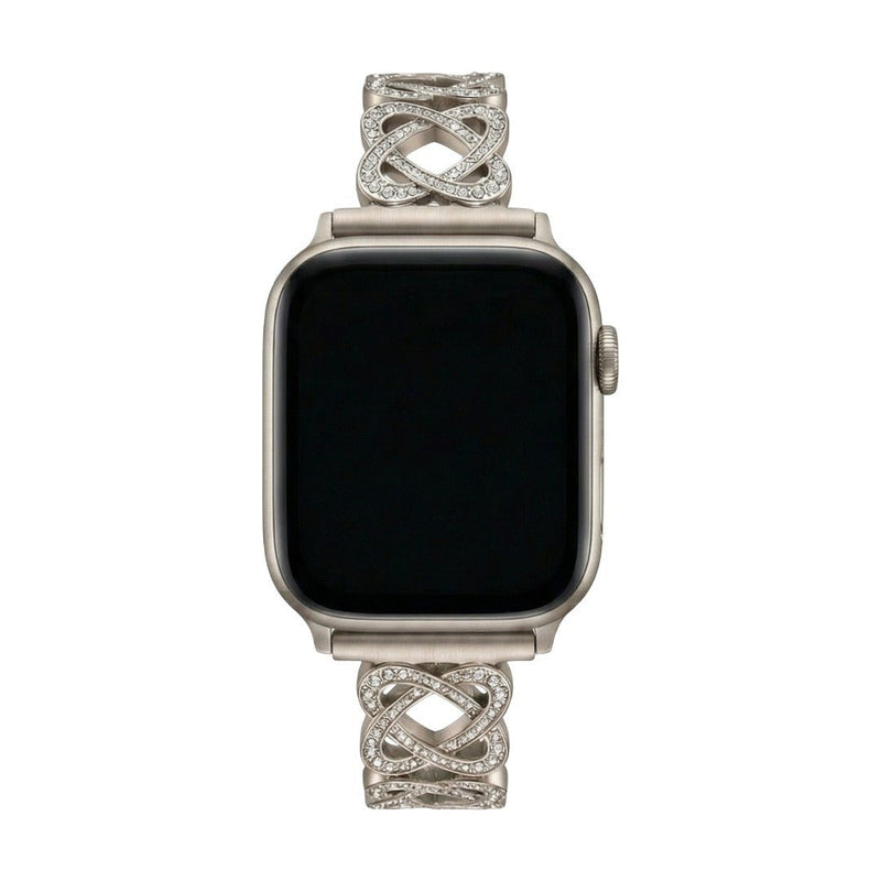 Pulseira para Apple Watch em metal prateado com malhas entrelaçadas, motivo de nó infinito cravejado de zircónias, fecho de encaixe ajustável, modelo Zergone