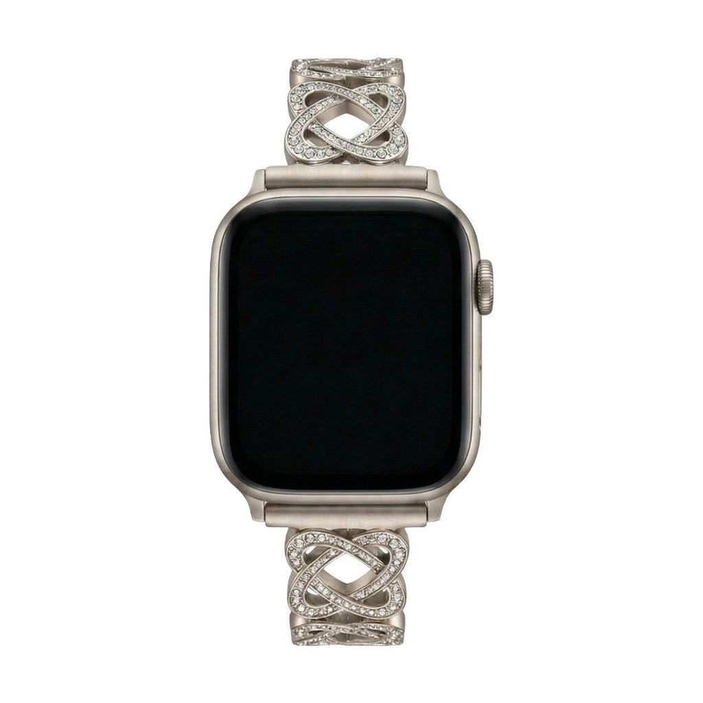 Pulseira para Apple Watch em metal prateado com malhas entrelaçadas, motivo de nó infinito cravejado de zircónias, fecho de encaixe ajustável, modelo Zergone