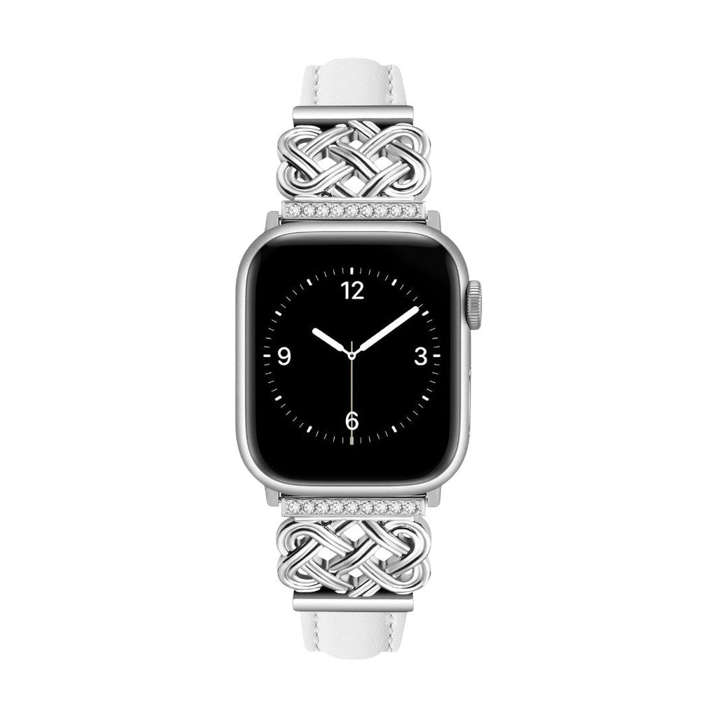 Bracelet pour Apple Watch en cuir blanc avec inserts métal argenté tressé et nœud celtique orné de zircons blancs.