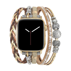 Apple Watch armbånd i flere rækker, guldfarvet, justerbart håndledssmykke med flettede remme og metalperler, elegant tilbehør til smartwatch, blank og tekstureret finish, model Rédine