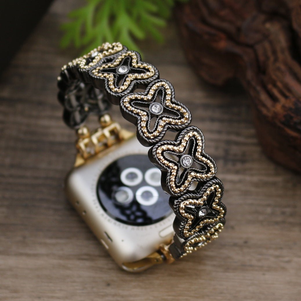 Apple Watch Armband mit durchbrochenem Blumenmuster, Strasssteinen und zweifarbiger Ausführung, Modell Harpie