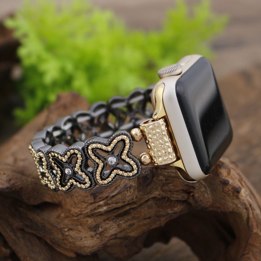 Apple Watch Armband mit durchbrochenem Blumenmuster, Strasssteinen und zweifarbiger Ausführung, Modell Harpie