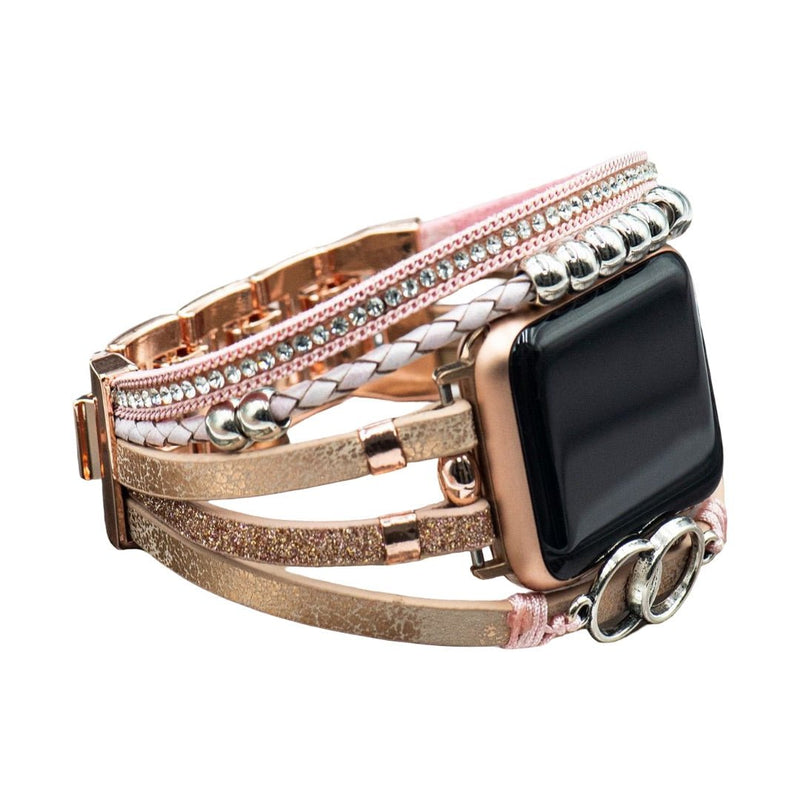 Bracelet Apple Watch multi-rangs en simili cuir rose doré avec strass et anneaux entrelacés, fermoir ajustable.