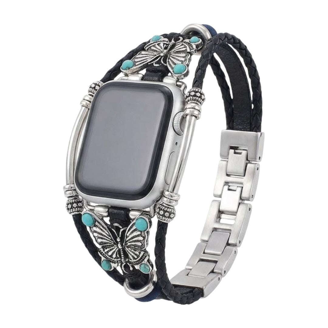 Bracelet Apple Watch noir en simili cuir tressé, papillons argentés et perles turquoise, fermoir métal argenté élégant.