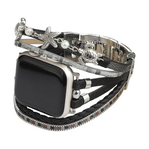 Bracelet Apple Watch noir style tropical chic avec perles argentées, tortue et étoile de mer en métal, simili vegan.