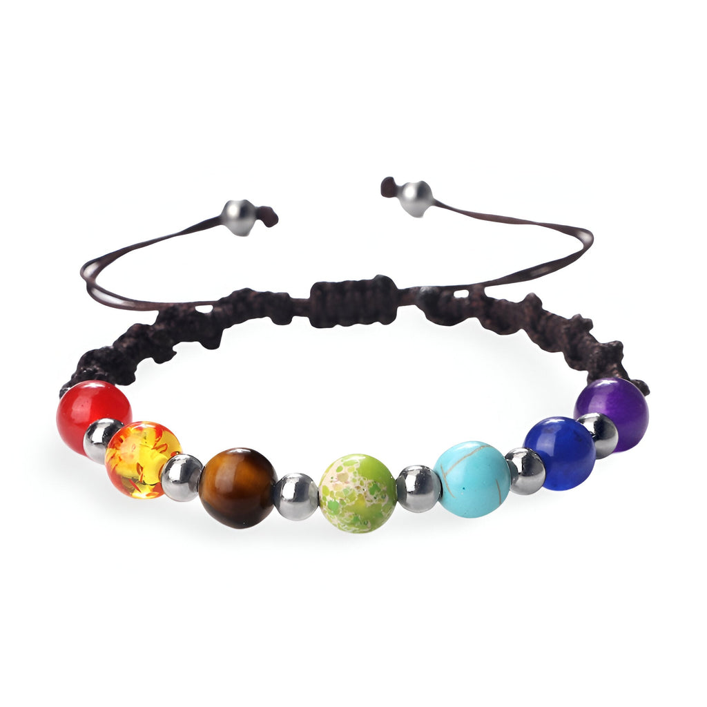 Bracelet aux 7 chakras avec perles colorées en pierres naturelles sur corde noire réglable.