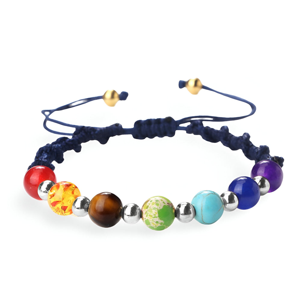 Bracelet aux 7 chakras en pierres naturelles multicolores sur corde bleu marine avec fermeture coulissante.