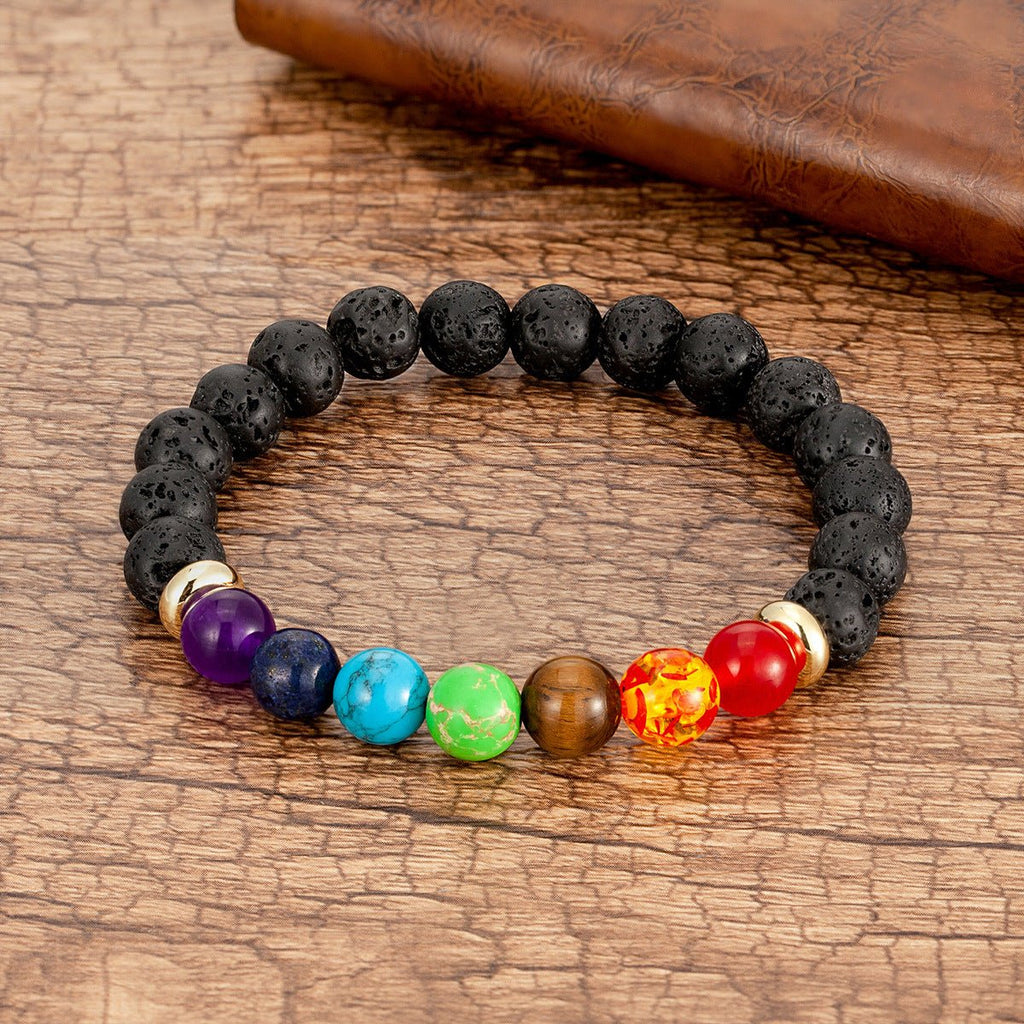 Bracelet mixte aux 7 chakras avec perles en pierres volcaniques noires et pierres naturelles colorées multicolores.