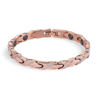 Bracelet femme en titane or rosé avec pierres hématite noires et détails brillants entrelacés.