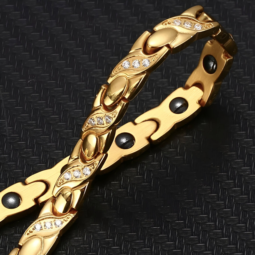 Bracelet femme or avec motifs incurvés et pierres brillantes, hématite noire intégrée.