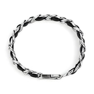 Bracelet homme en cuir noir tressé avec maillons en titane argenté et fermoir métallique élégant.