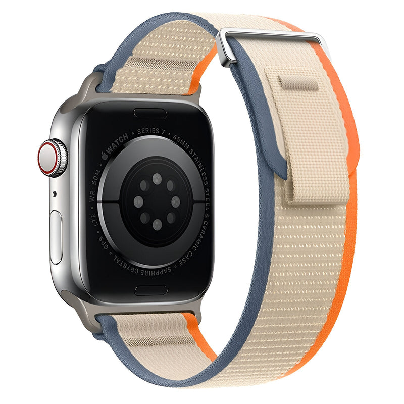 Bracelet Apple Watch Elios nylon beige avec bordure orange et fermeture velcro bleue.